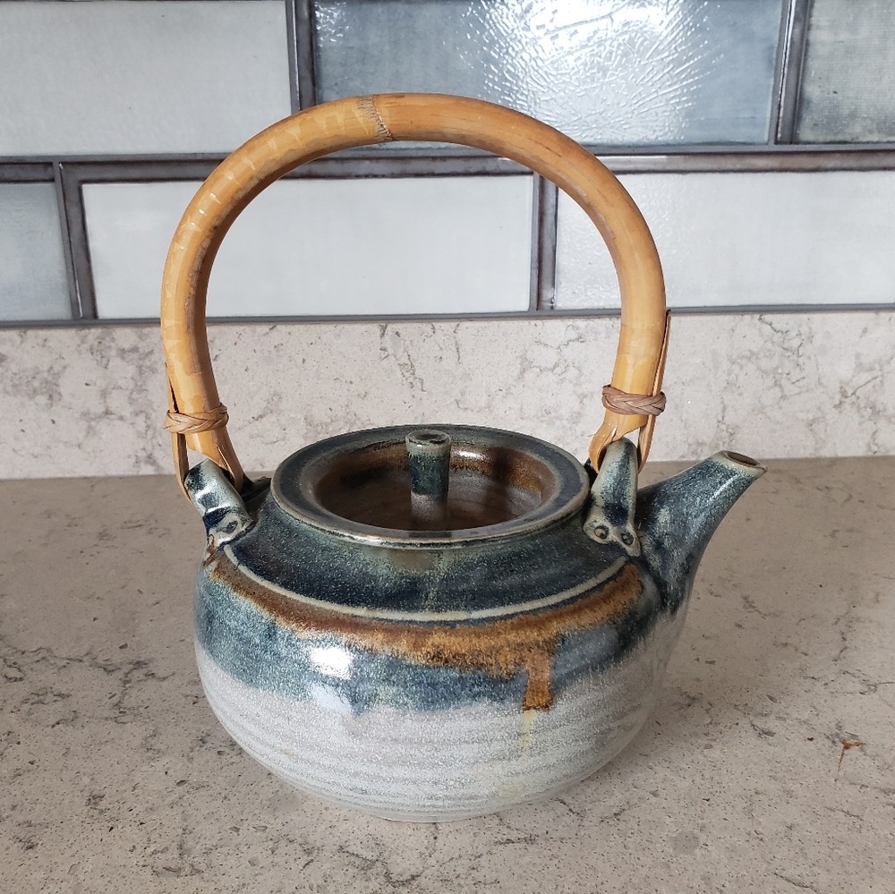 Classic MCM pottery teapot with bamboo handle.